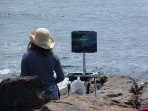 Artist sitting in rocks